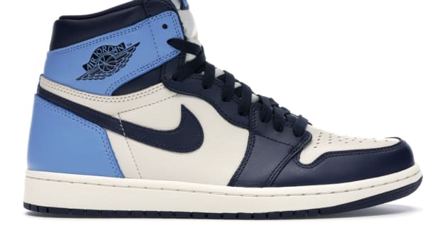 View of white, navy, light blue Jordan 1 shoes.